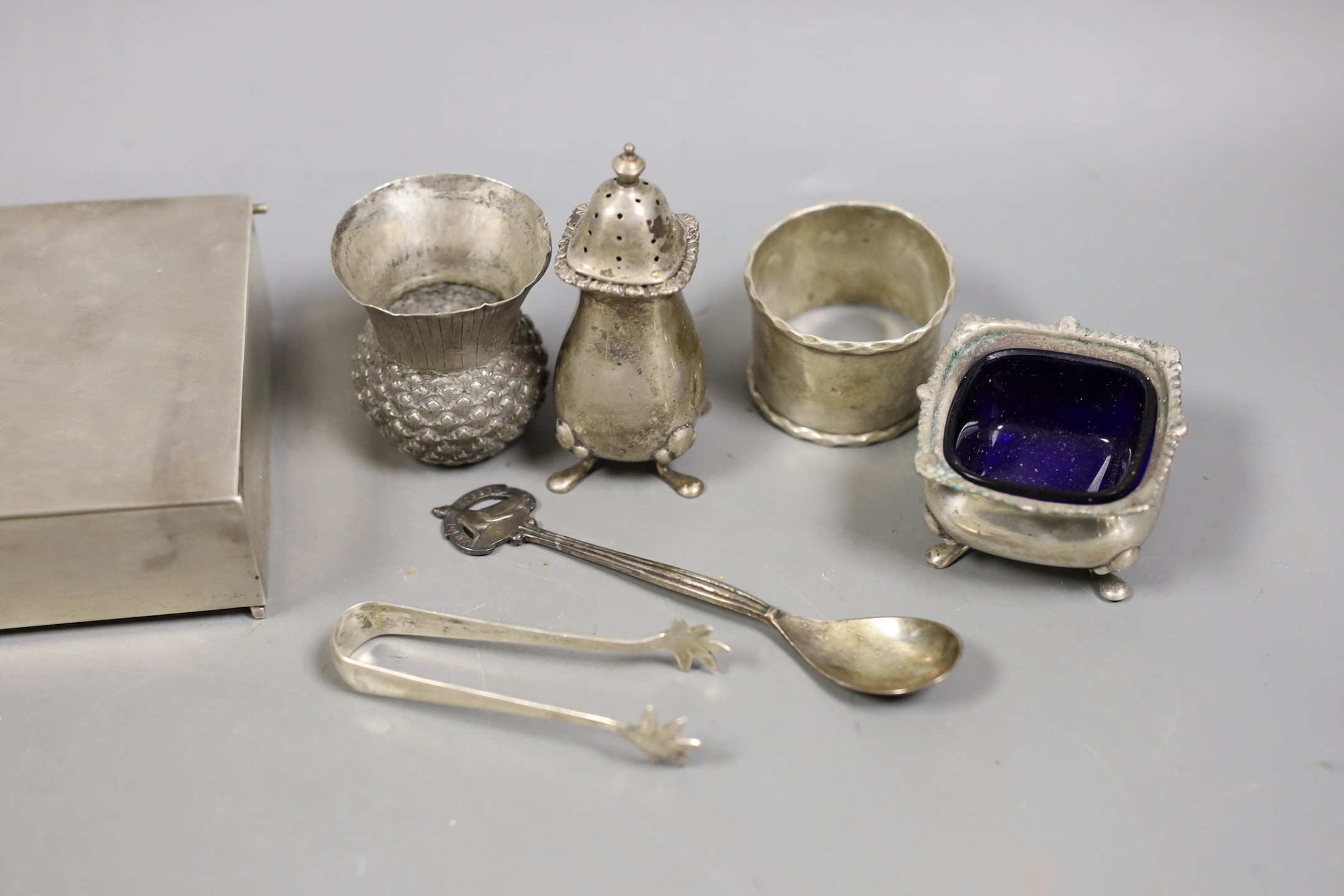 A George V silver mounted cigarette box, 11.5cm and other small sundry silver and plated items including napkin rings, condiments and small dish.
